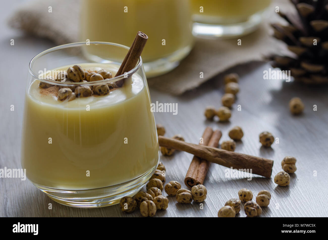 Boza or Bosa, traditional Turkish drink with roasted chickpeas and cinnamon on the table. top view Stock Photo