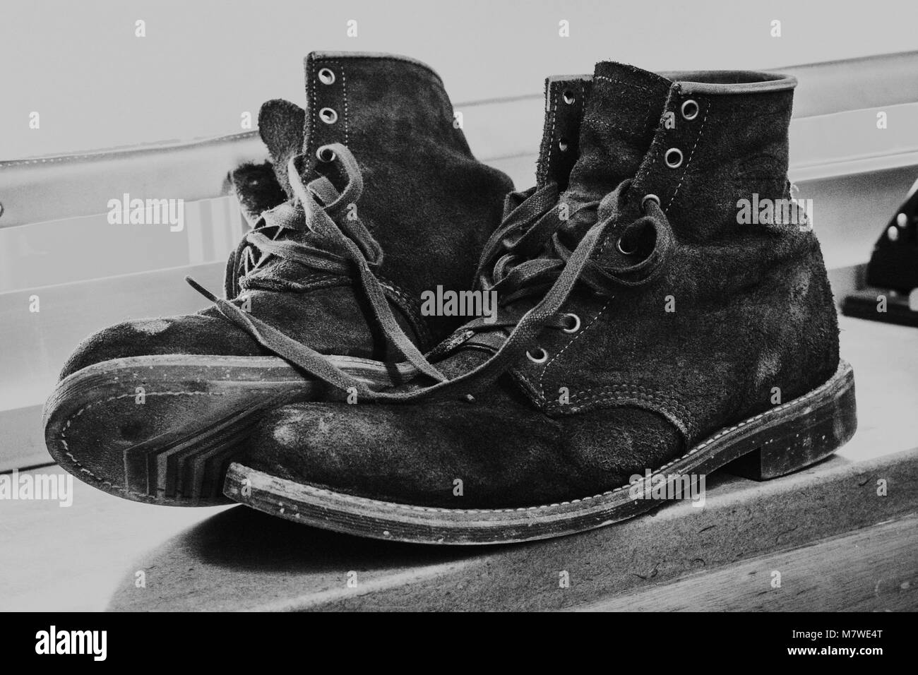 Pair of boots untied Stock Photo - Alamy