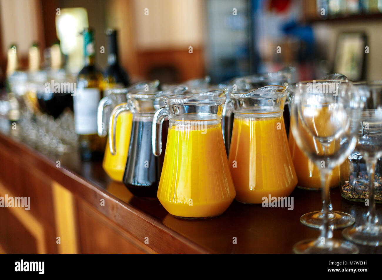 A carafe of fresh juice of orange and grapes on the bar Stock Photo Alamy