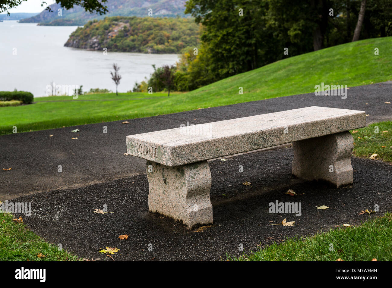 New York, USA.  Bench Inscription at Trophy Point, West Point Military Academy:  Courage.  Hudson River in background. Stock Photo