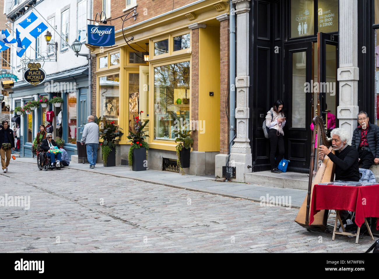 Quebec, Canada.  Harpist Playing in the Place Royale, Lower Town. Stock Photo