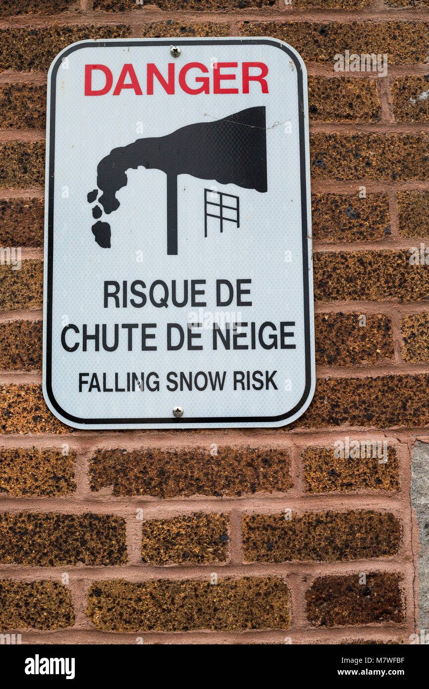 Quebec, Canada.  Sign Warning of Risk of Falling Snow, Chateau Frontenac. Stock Photo