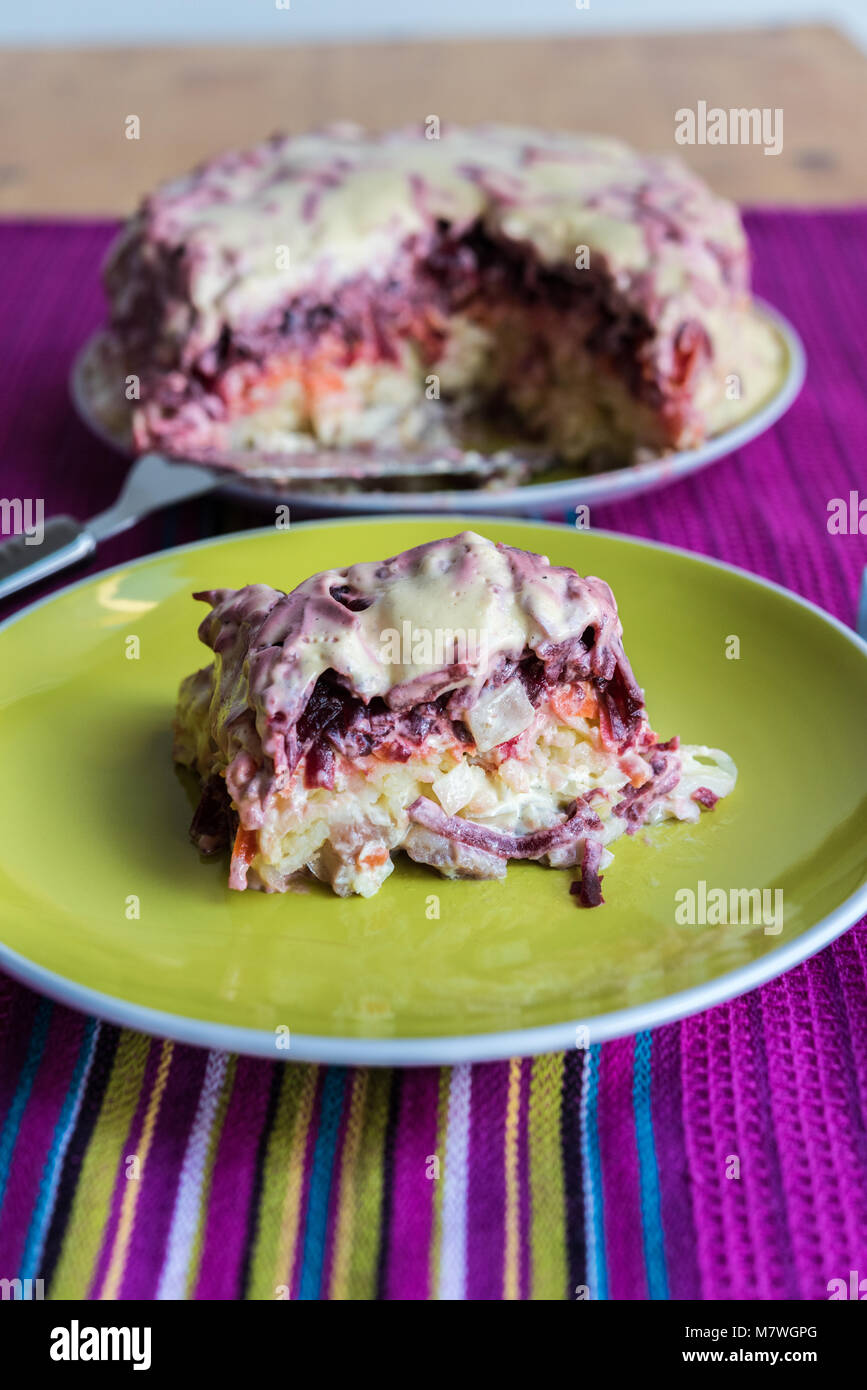 Russian Dressed Herring sliced on a plate and ready to eat Herring
