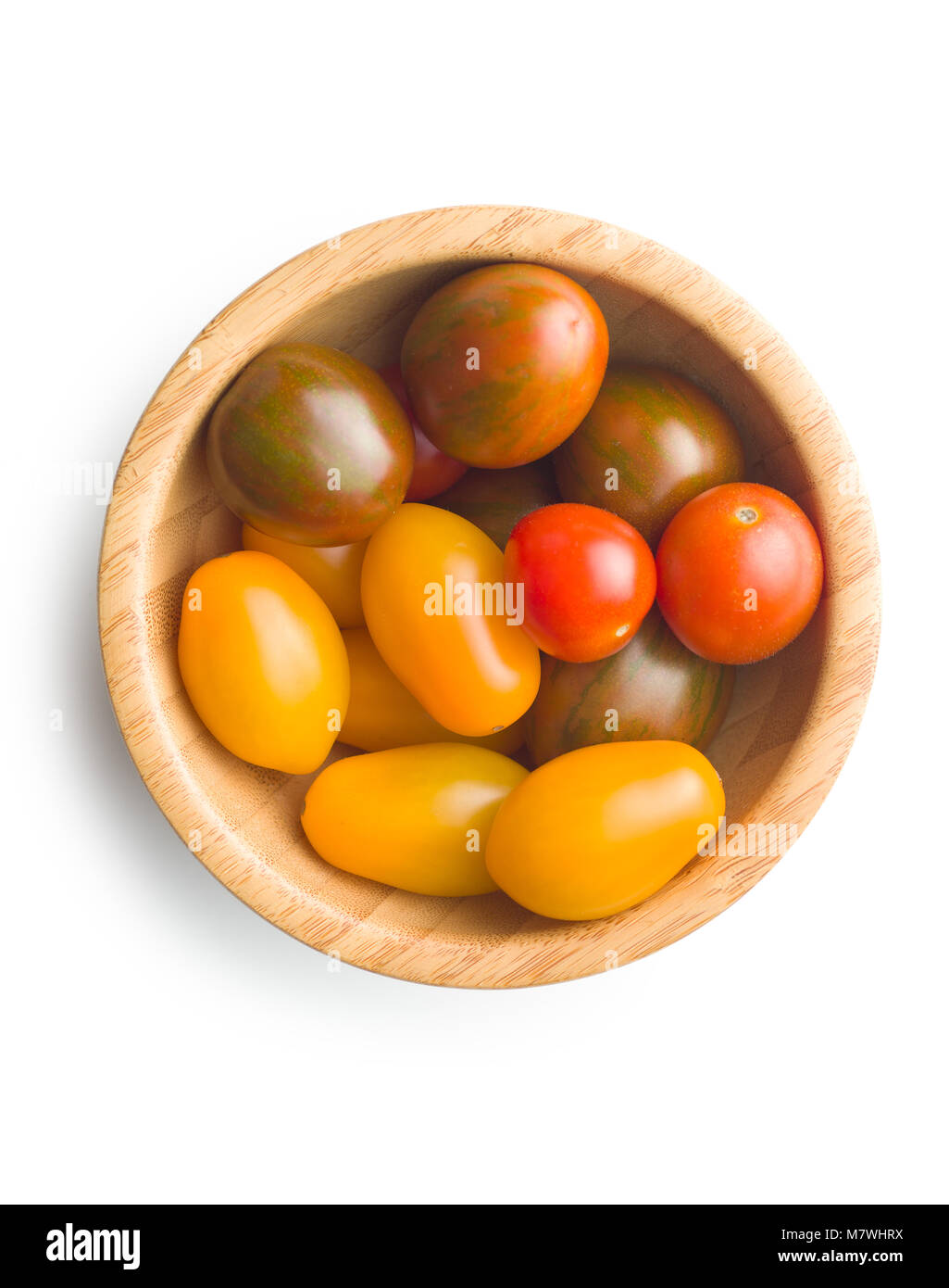Tasty cherry tomatoes in wooden bowl isolated on white background Stock ...