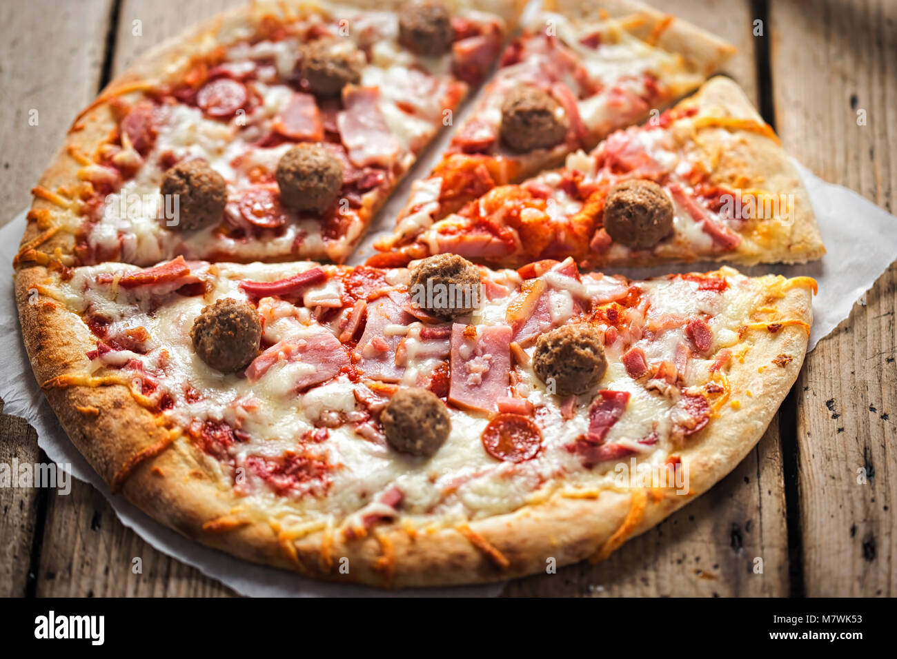 Meat feast pizza with ham, bacon, beef Stock Photo Alamy
