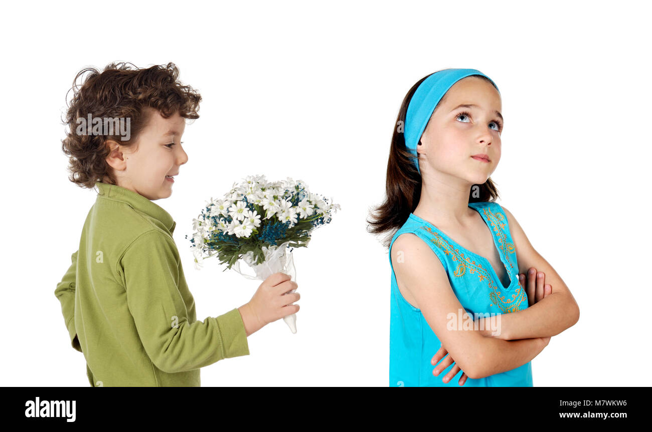 Small child giving a bouquet to his girl isolated on a white background Stock Photo