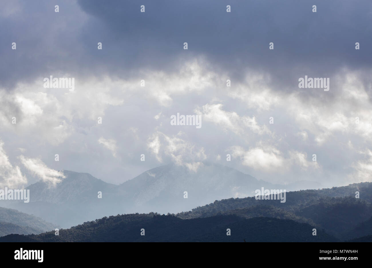 cloudy sky above the green hills and trees Stock Photo - Alamy