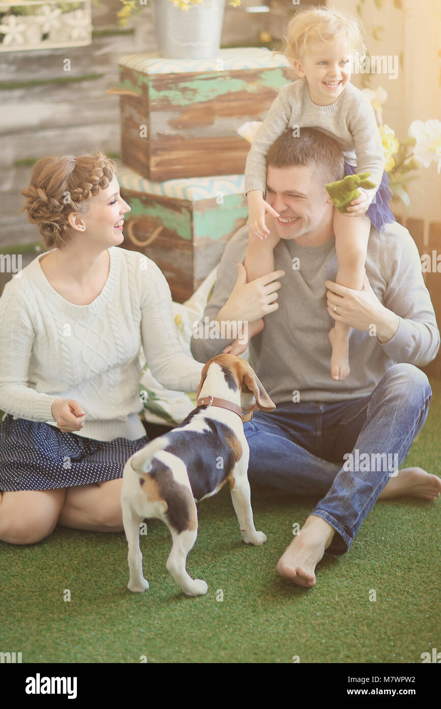 mom,dad and little daughter homemade dog resting in a country house Stock  Photo - Alamy