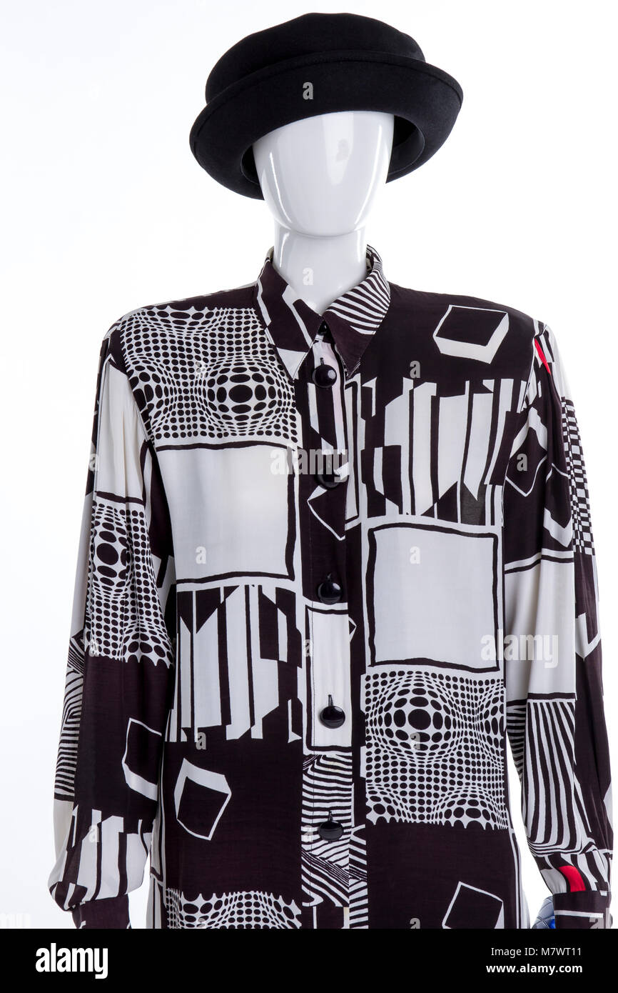 Black and white outfit on mannequin. White isolated background Stock