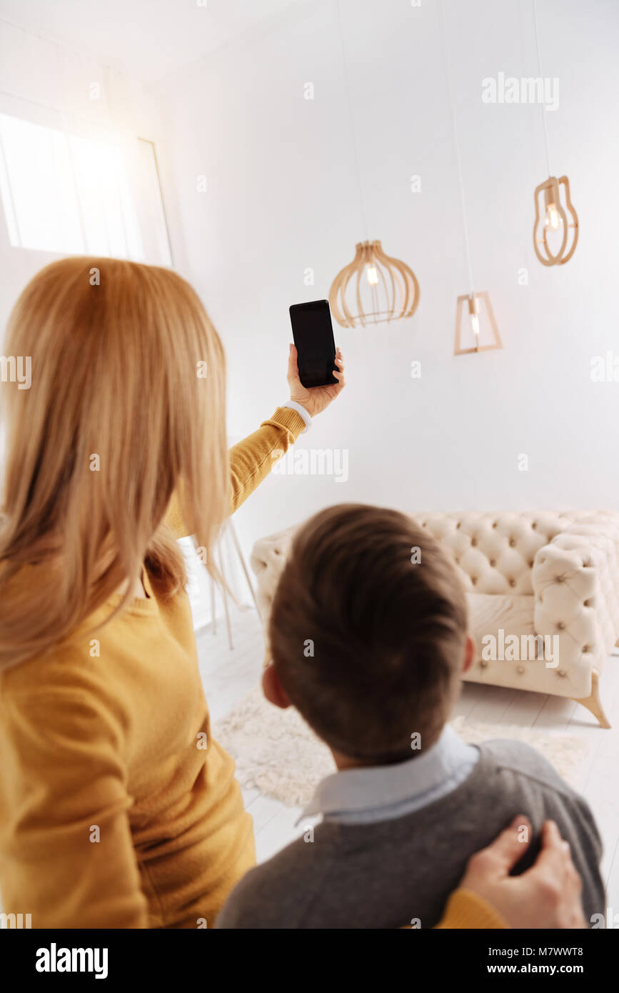 Positive happy woman taking a selfie Stock Photo - Alamy