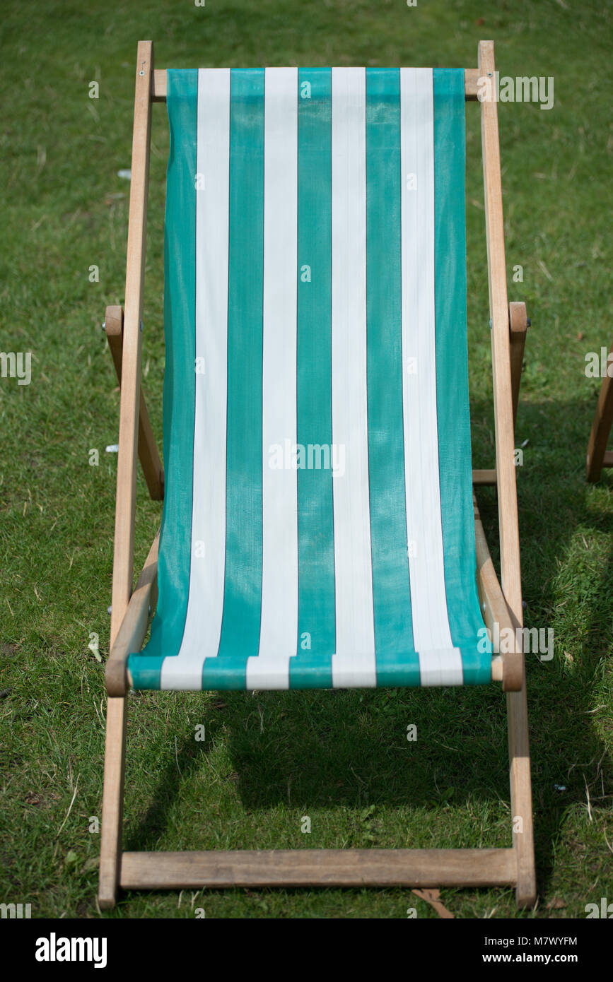 isolated unoccupied deck chairs in English garden Stock Photo Alamy