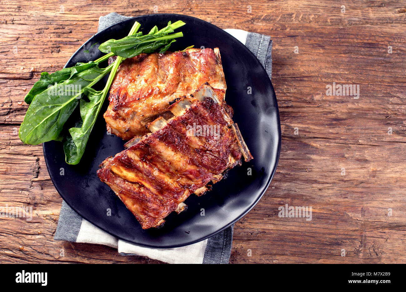 Barbecue spare ribs on an rustic wooden table Stock Photo - Alamy