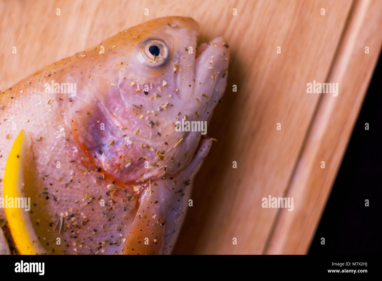 Raw Trout on a Black Wooden Table. Home Preparation of Trout.Healthy Diet  Food. Fresh Fish Ready for Grilling Stock Photo - Image of organic, fresh:  224732048