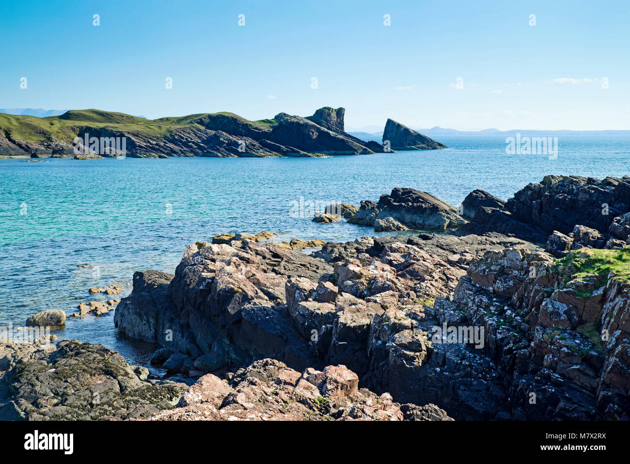 The Split Rock at Clachtoll Bay seen across the rocky foreshore, Assynt, Sutherland, North Coast 500 route, Scottish Highlands, Scotland UK Stock Photo