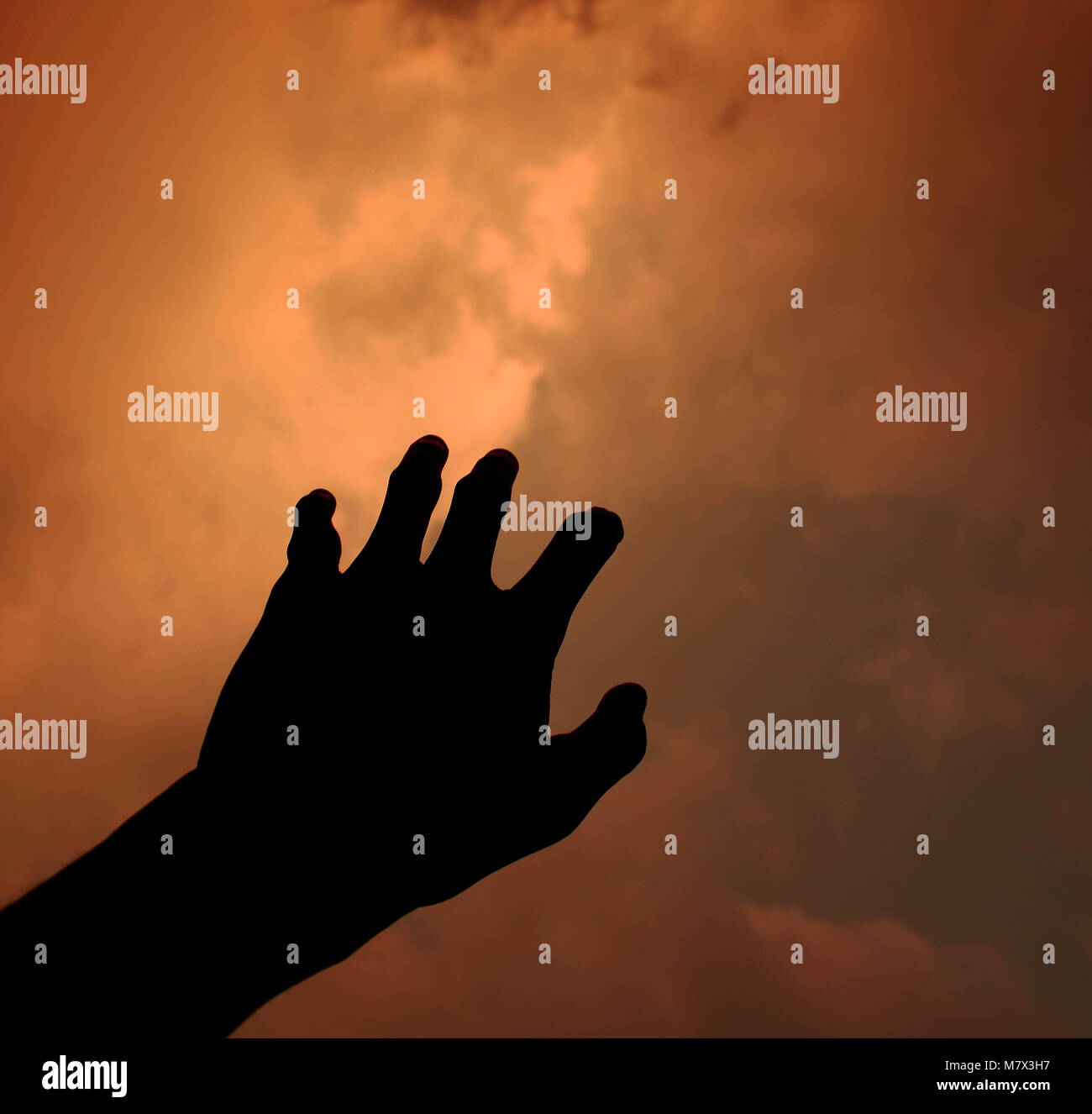 Hand reaching to sky hi-res stock photography and images - Alamy