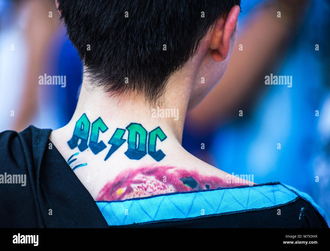 Genoa Italy, September 2016. ACDC tattoo on the back of a young girl /  tattoo/ Band/ girl/ cosplay Stock Photo - Alamy