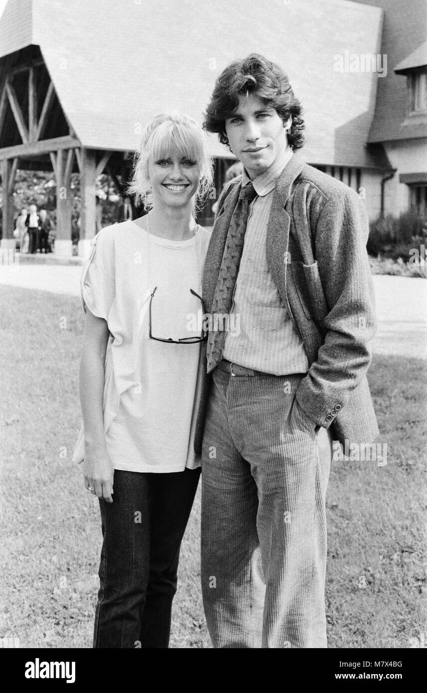 John Travolta and his co star Olivia Newton John in England during the week of release of the film Grease.  Grease was released in the UK on 14th September 1978.  Grease is a 1978 American musical romantic comedy film based on Jim Jacobs and Warren Casey's musical of the same name. The film depicts the life of Rydell High School students Danny Zuko and Sandy Olsson in the late 1950s.  Directed by Randal Kleiser and written by Bronte Woodard, the film stars John Travolta as Danny, Olivia Newton-John as Sandy and Stockard Channing as Betty Rizzo. Grease was successful both critically and commerc Stock Photo