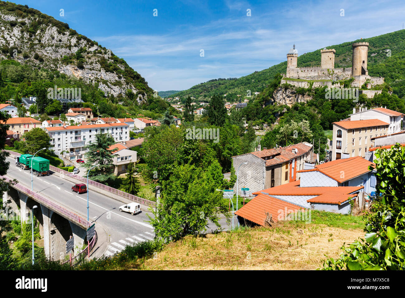 Foix (south-western France), May 2015. Listed as a 'monument historique' (historic monument) since 1840, the fortress dominates the town. In the foreg Stock Photo
