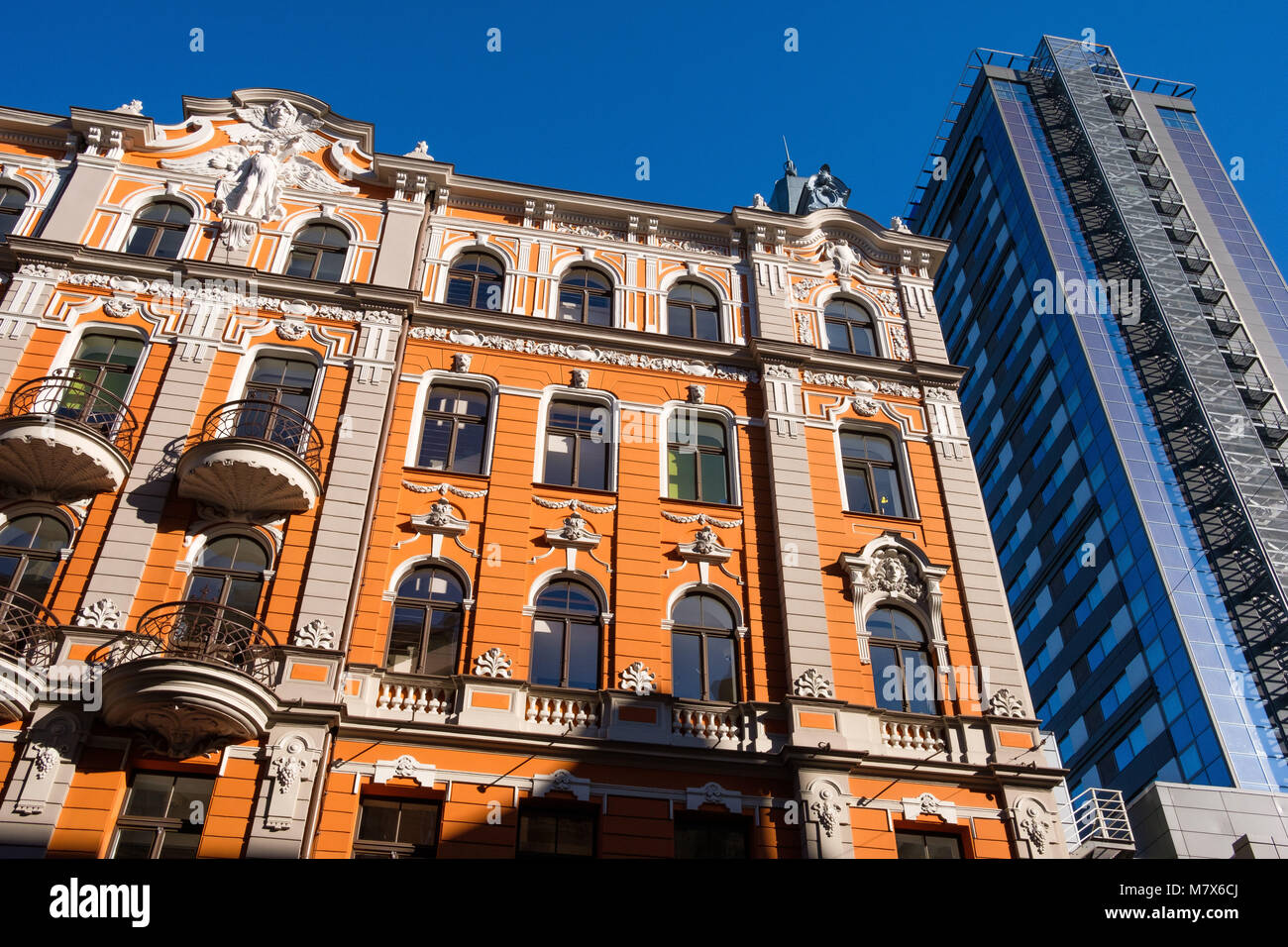 Latvia, Riga. Buildings in the Art Nouveau style in the medieval Old Town (Vecriga). Renovated facade near the building of the Radisson Hotel. Stock Photo