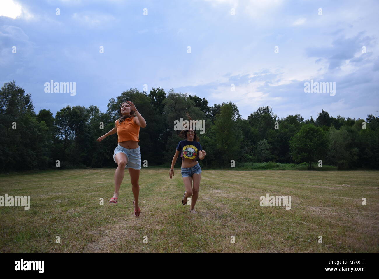 The girls just wanna have fun in the field in the village. These girls ...