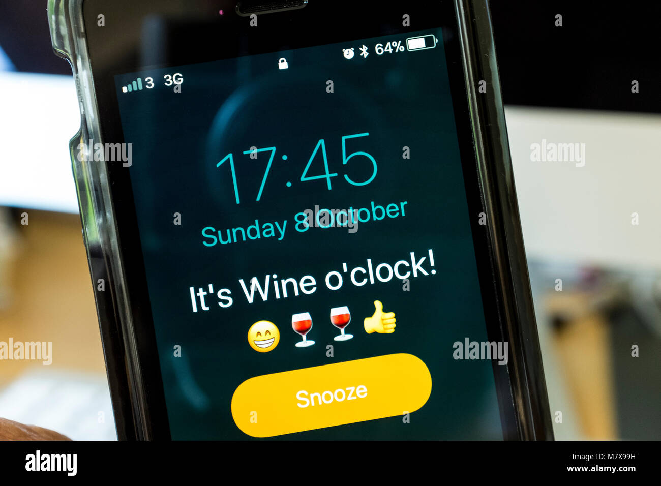 Alarm on iPhone saying It's Wine o'clock. Stock Photo