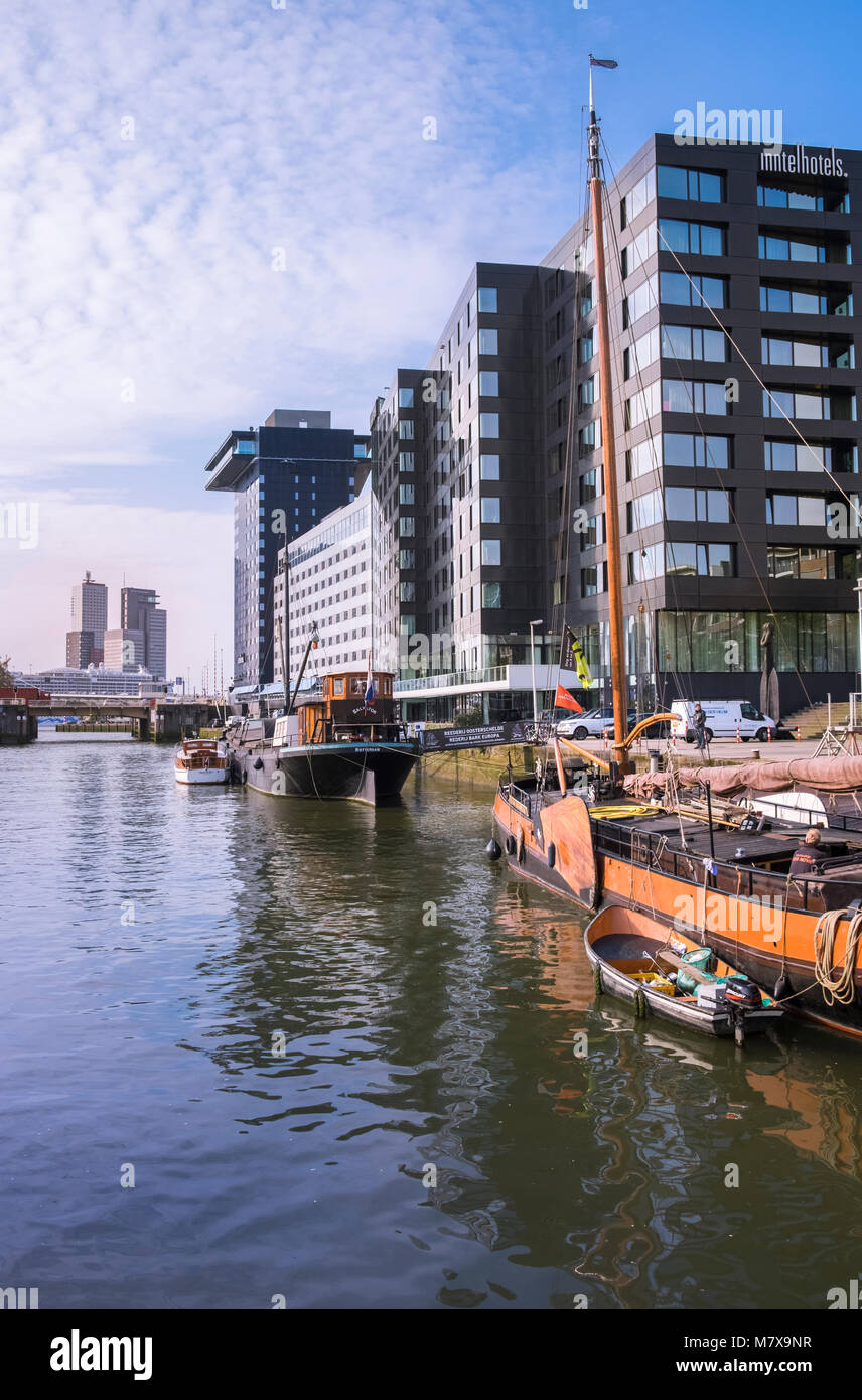Leuvehaven harbour, where boat exhibits from the Maritime Museum and modern Dutch architecture can be seen together, Rotterdam, The Netherlands. Stock Photo