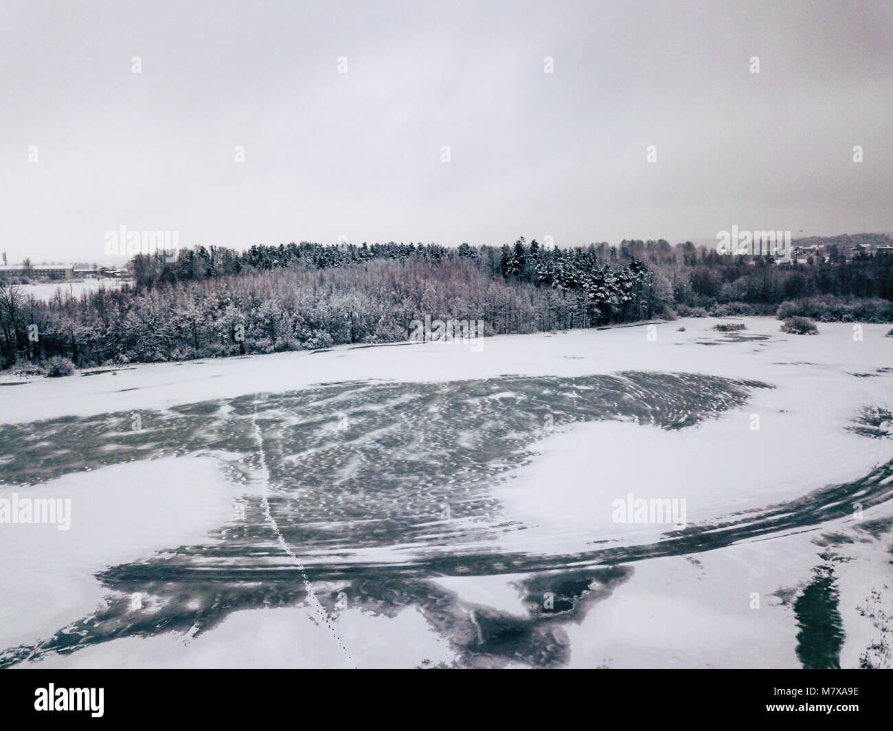 Aerial Photography of a Bright Forest and a Frozen Lake in a Foreground ...