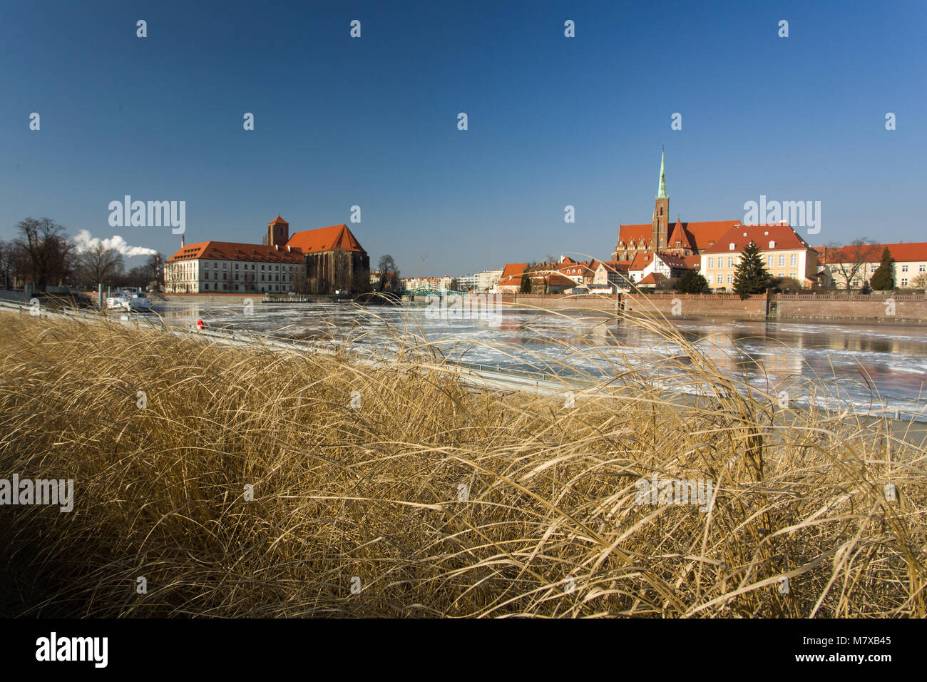 River Odra, church Saint Maria of the Sand and Collegiate Church of the Holy Cross and St. Bartholomew. Wrocław, Poland. Stock Photo