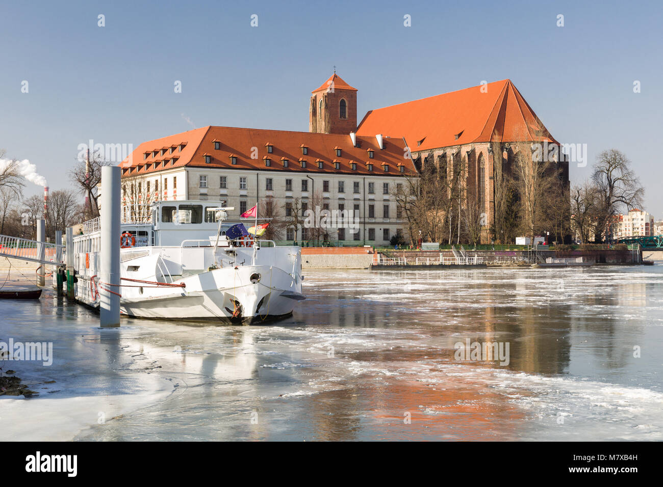 A cruise ship on the frozen Odra River in Wrocław, Poland. Stock Photo