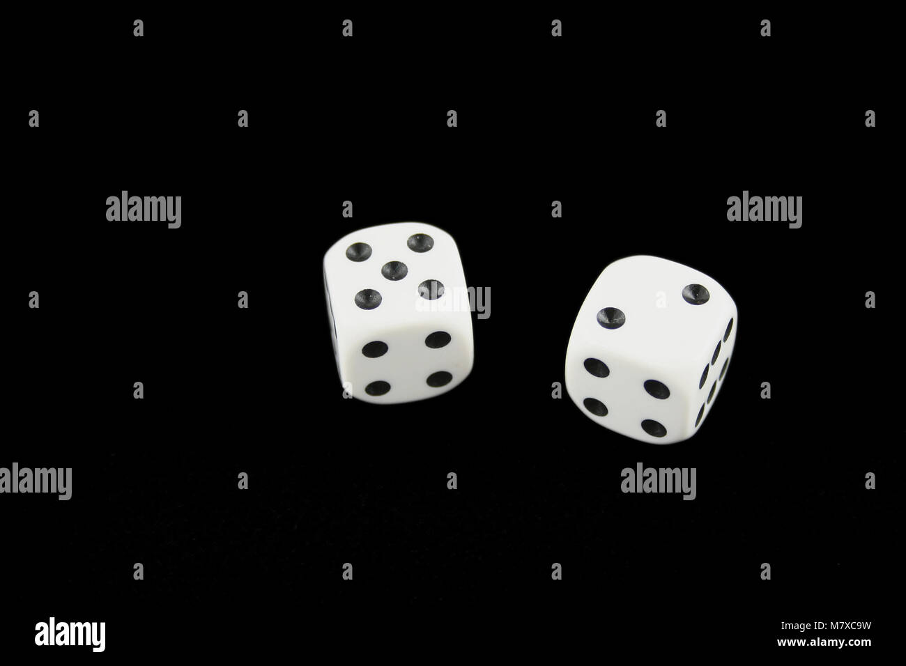 Seven and boxcars dice isolated on black background Stock Photo Alamy
