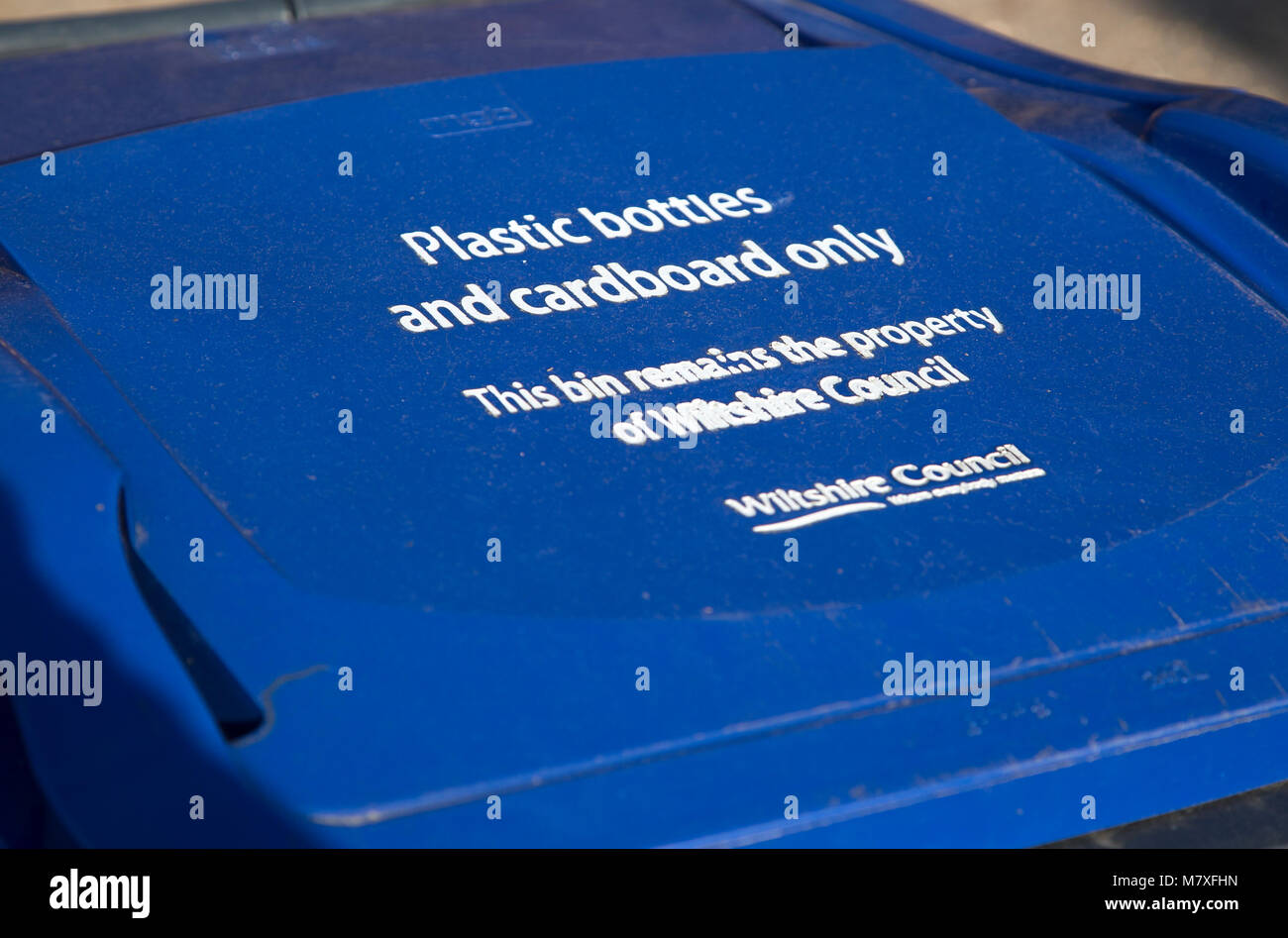 Blue recycling bin for plastic bottles and cardboard only, Wiltshire