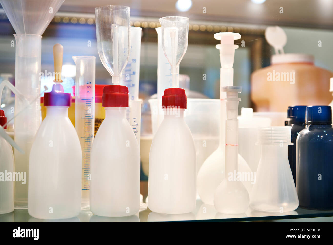 Plastic bottles for chemicals on shelf Stock Photo Alamy