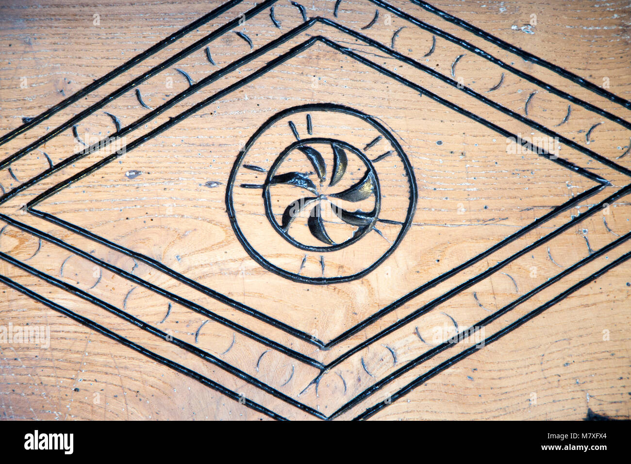 Old Carved Decorations In Wooden Fireplace Surround Of Village Pub