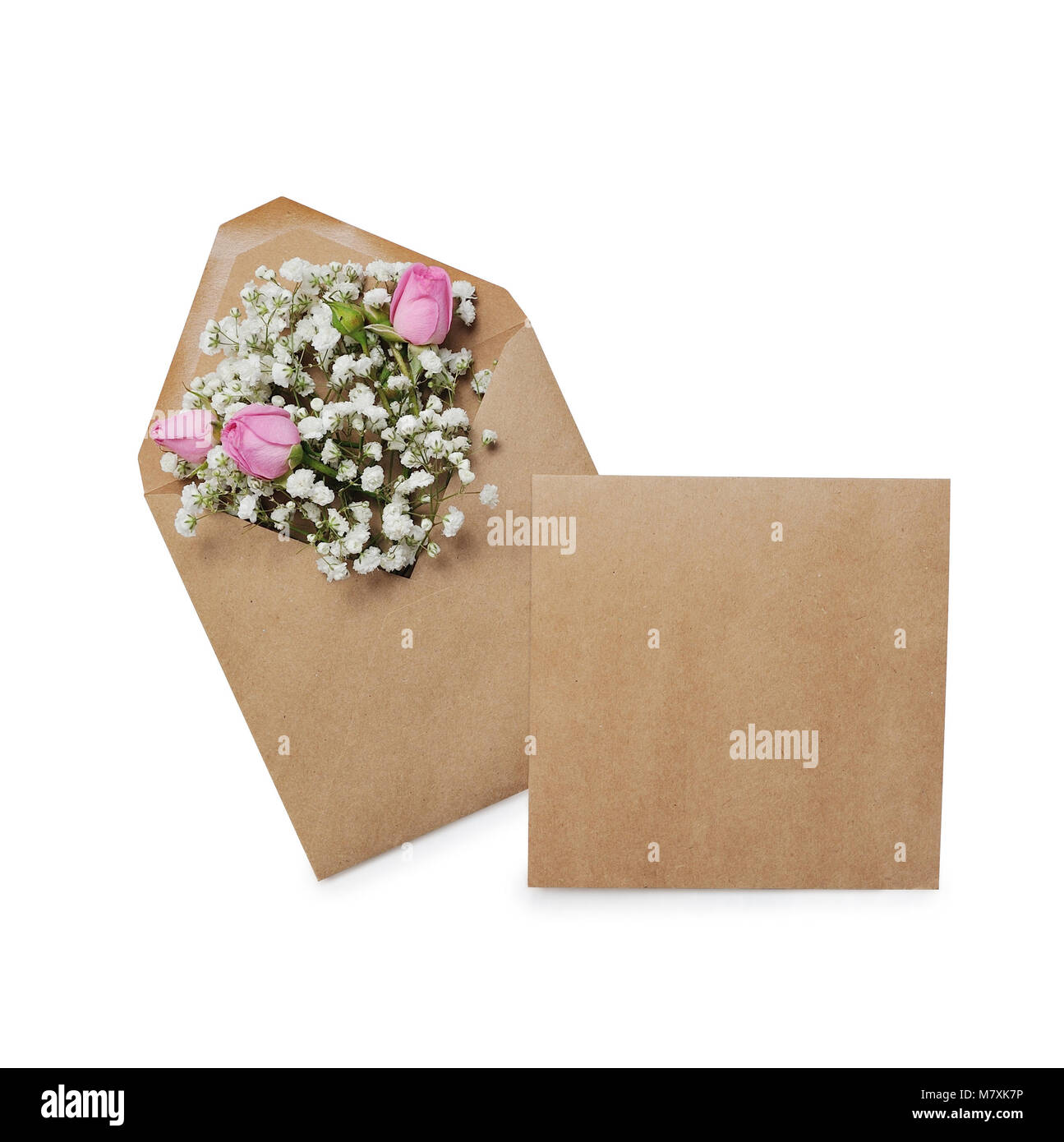 Mockup kraft envelope full of various flowers rose. Flat lay. Love