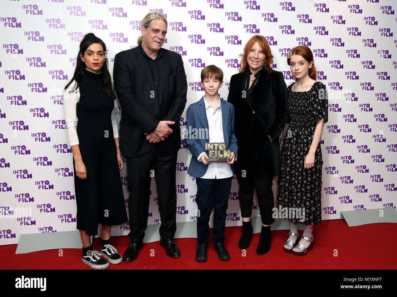 Rosie Day (right) and Georgina Campbell (left) alongside Jude from London (centre) with the Best Animation (13 and over) awards for 'Ashta and the Dragon' at the Into Film Awards 2018 held at the BFI Southbank, London. PRESS ASSOCIATION Photo. Picture date: Tuesday March 13, 2018. Photo credit should read: Isabel Infantes/PA Wire Stock Photo