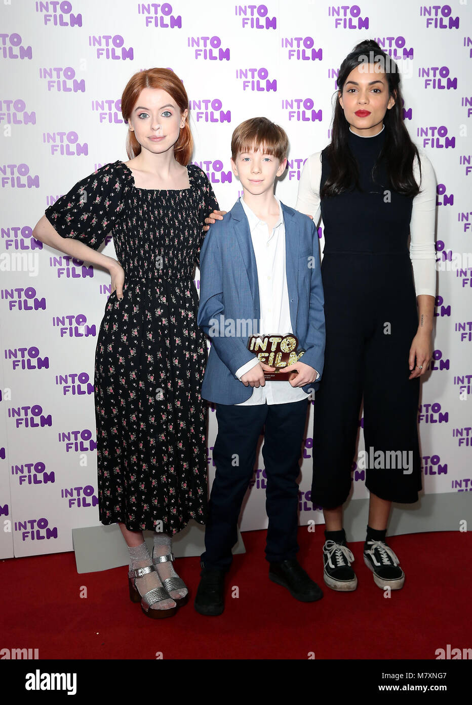 Rosie Day (left) and Georgina Campbell (right) alongside Jude from London with the Best Animation (13 and over) awards for 'Ashta and the Dragon' at the Into Film Awards 2018 held at the BFI Southbank, London. Stock Photo