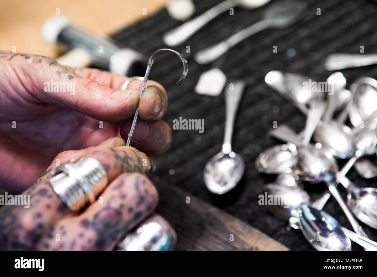 Jewellery made from silver spoons - artisan trader at Camden Market. Stock Photo