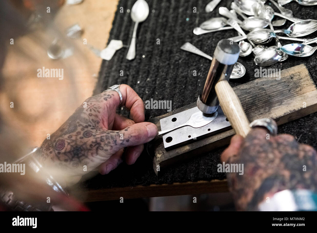 Jewellery made from silver spoons - artisan trader at Camden Market. Stock Photo