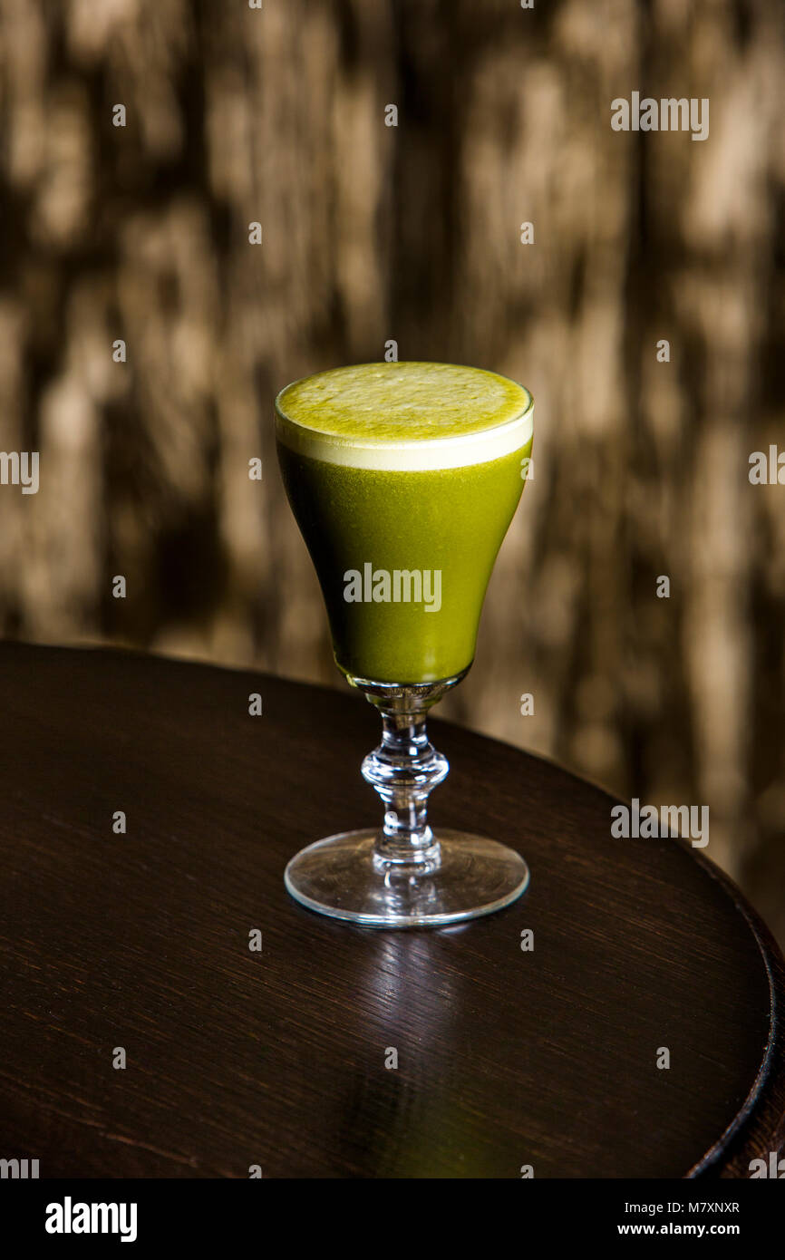 Mocktail, Matcha sour alcohol free cocktail pictured in sophisticated lounge bar. Stock Photo