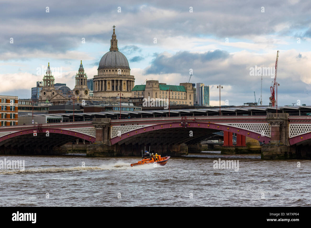 LONDON, UK – JAN 2018: Orange speedboat on River Thames on winter day Stock Photo