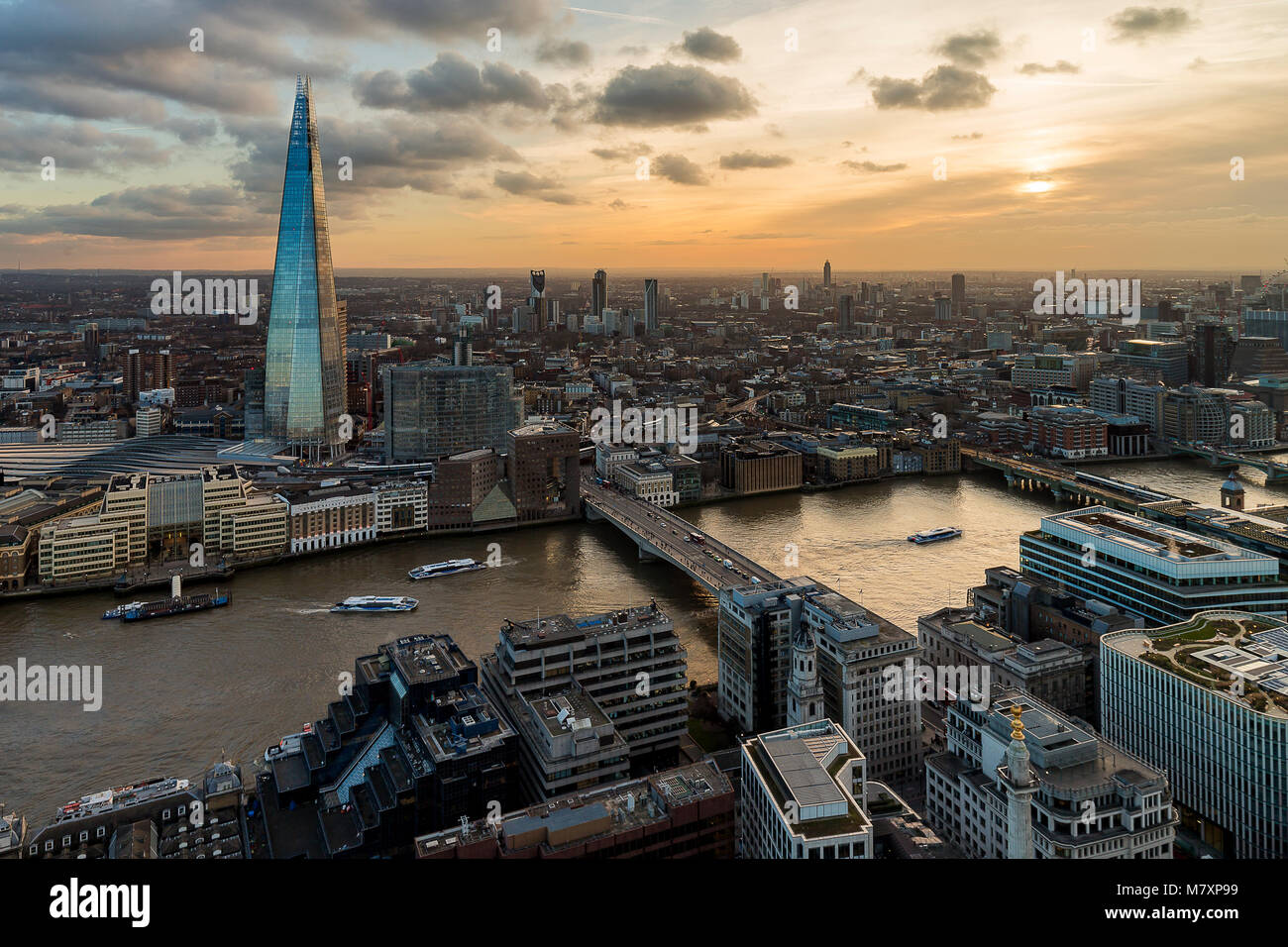 LONDON, UK – FEB 2018: Panoramic aerial view of London with the Shard skyscraper and Thames during sunset. Stock Photo