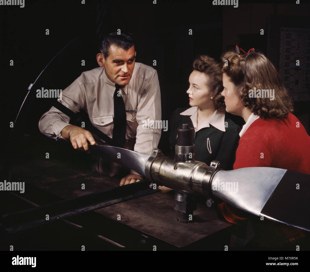 Instructor Ralph Angar Explaining Propeller Characteristics to Two