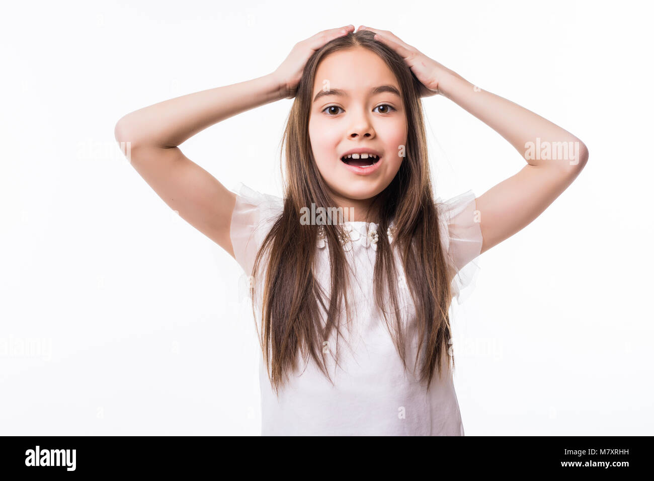 Portrait of surprised little girl on white Stock Photo - Alamy