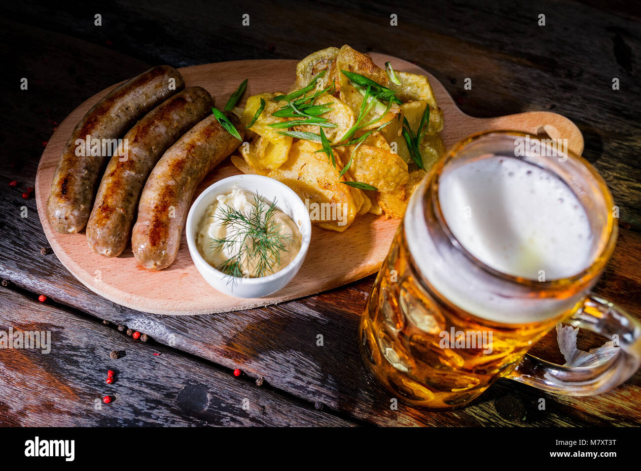 Assorted beer snacks with beer mug Stock Photo