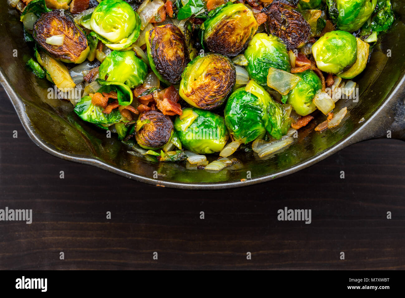 Wide Half View of Roasted Brussels Sprouts and Bacon in cast iron