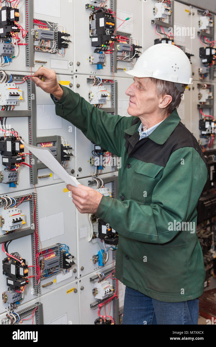 Electrician With Wiring Diagram Indoors Stock Photo Alamy