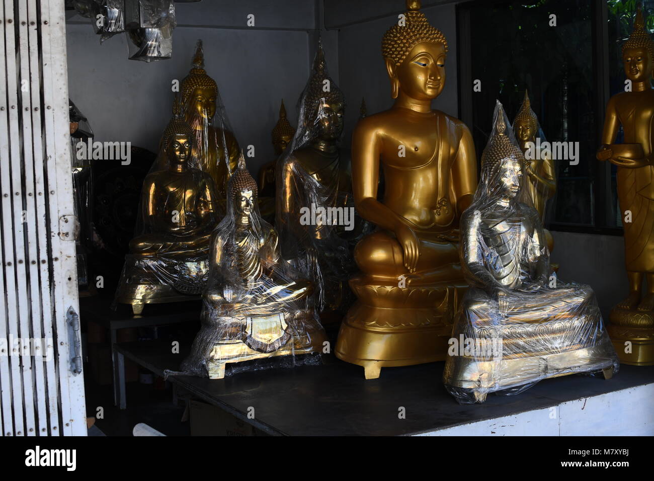 Shop Selling Buddha Statues High Resolution Stock Photography and