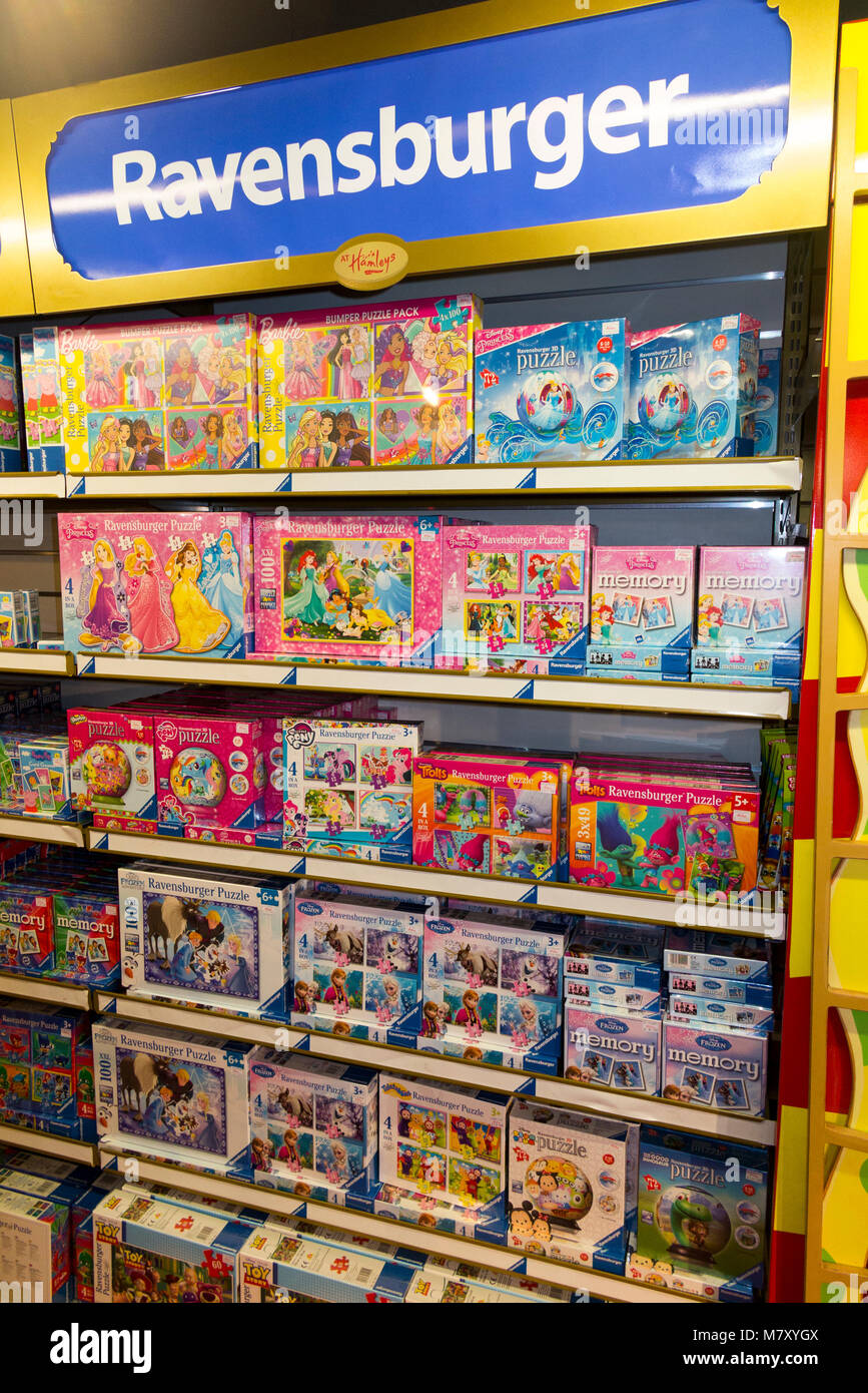 Boxes of Ravensburger jigsaw puzzles / jig saw puzzle  on sale in the world famous London toy shop, Hamleys. Regent street. UK. (96) Stock Photo