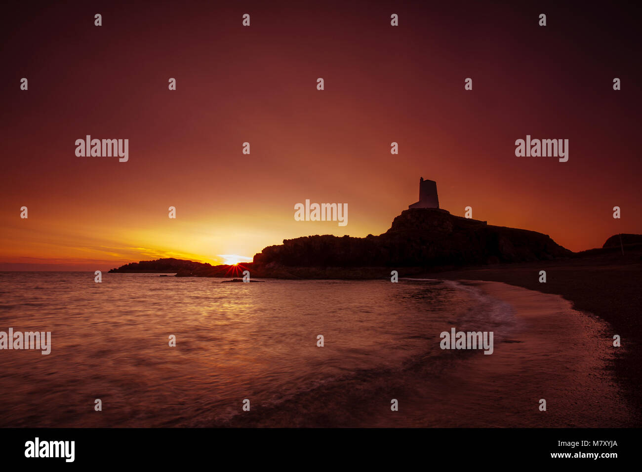 Watchtower at sunset on Llanddwyn Island, Anglesey, North Wales coast Stock Photo
