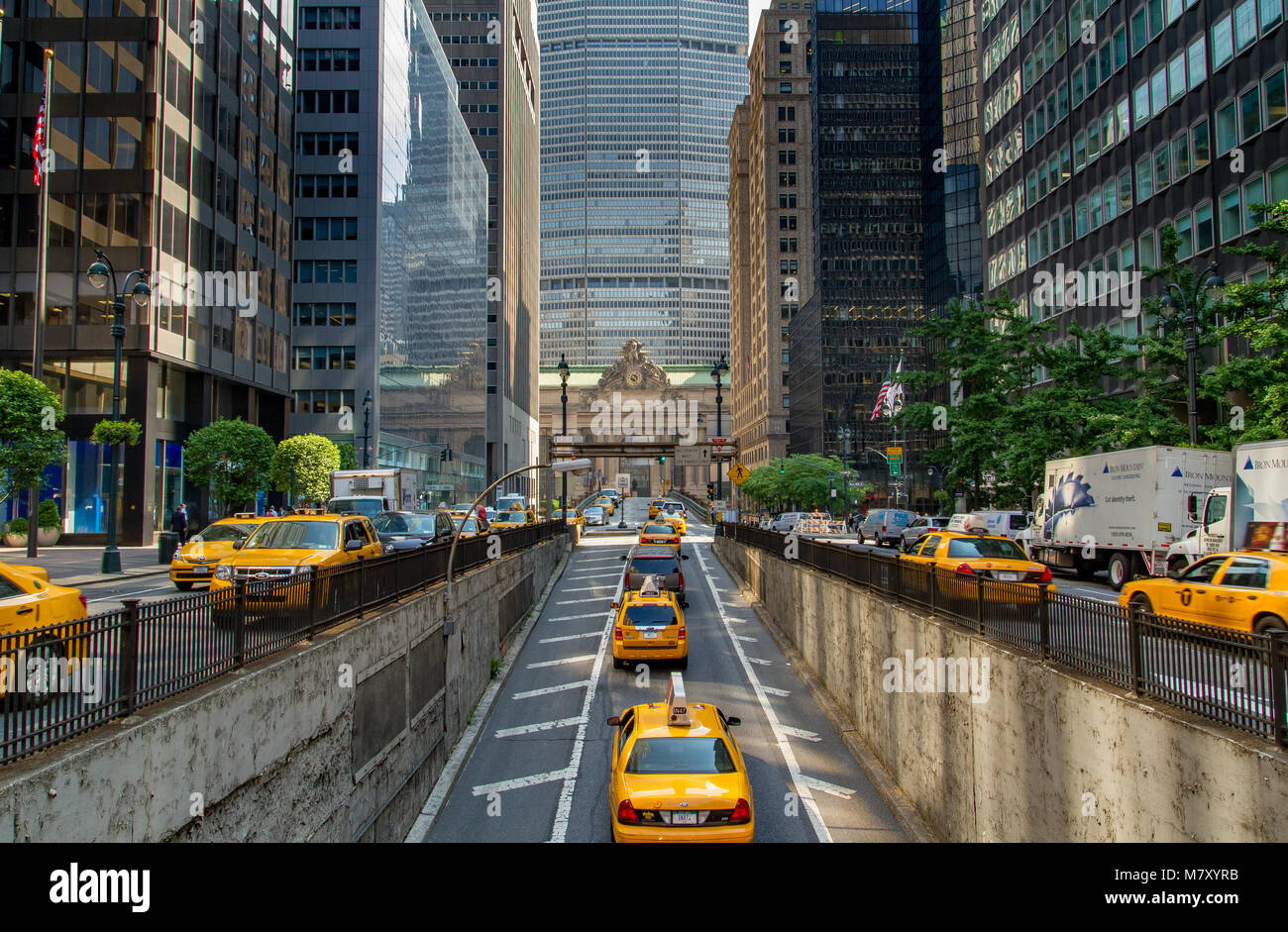 Yellow New York taxis emerging from The Park Avenue Tunnel towards The Park Avenue Viaduct and Grand Central Terminal in Manhattan, New York City Stock Photo